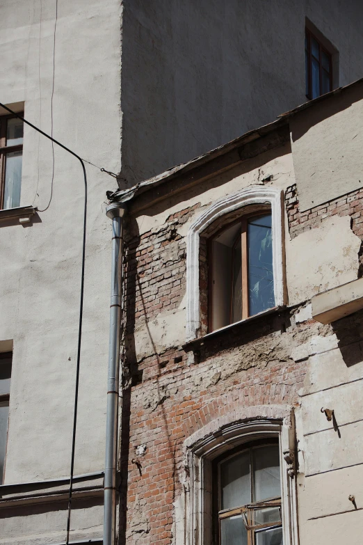 there is a window and the side of this building