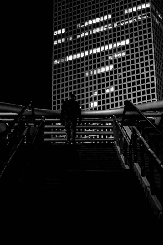 a person walking down some stairs in front of a building