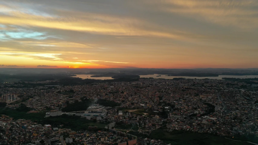 an airplane flies above the city and lake