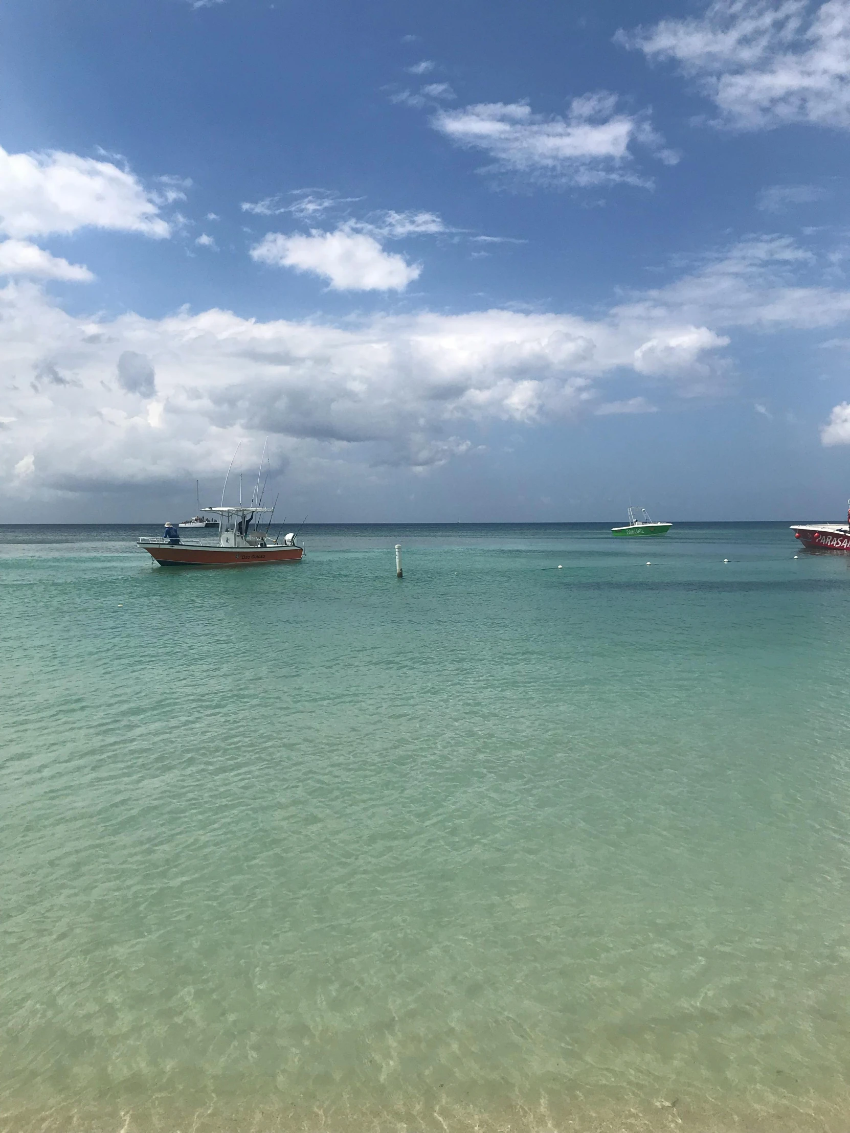 two boats floating on top of a body of water