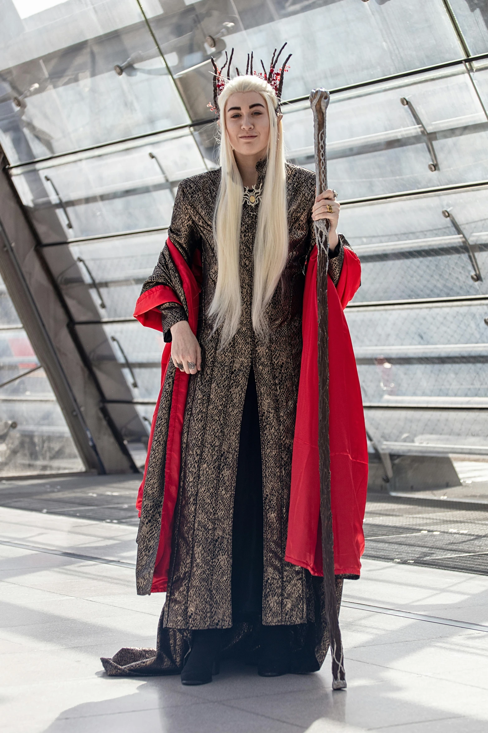 woman in costume standing with two metal swords