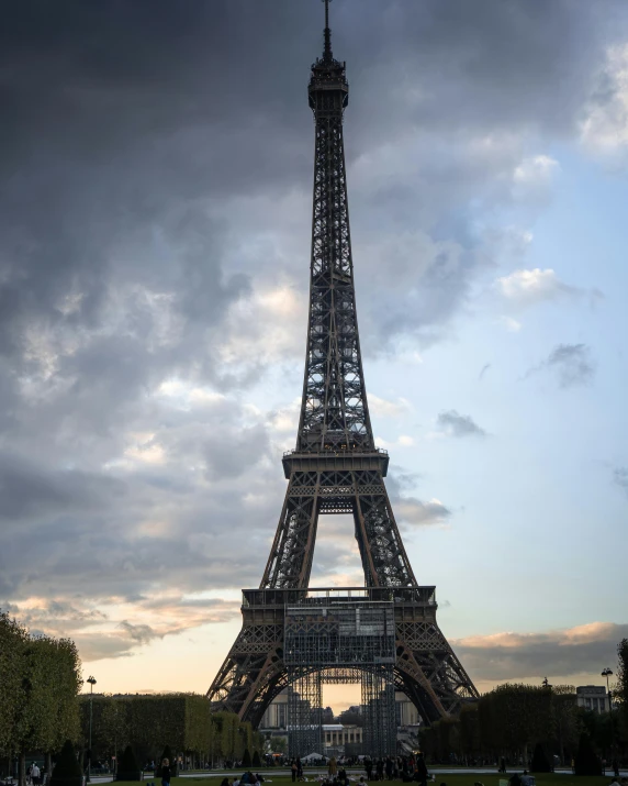 eiffel tower with cloudy sky in background