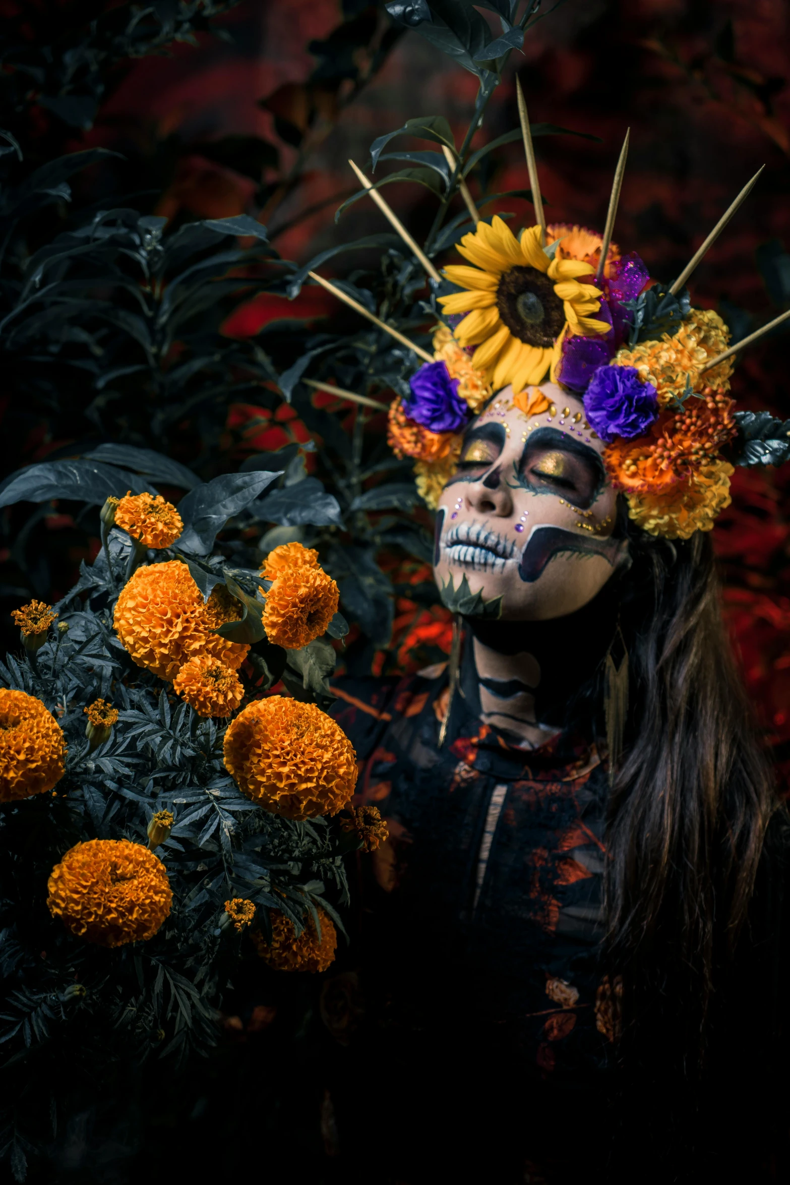 a person with painted skull makeup and flower headdress