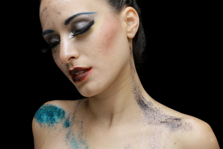 woman with makeup and body art all over her