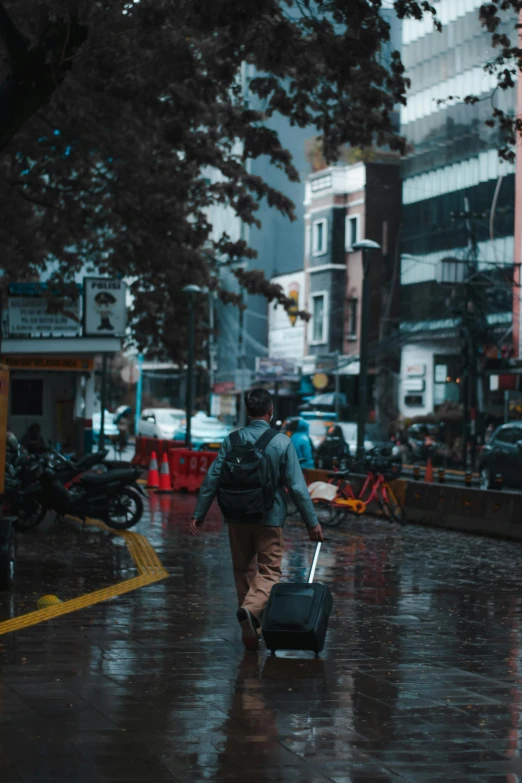 a person walking down the street carrying a bag