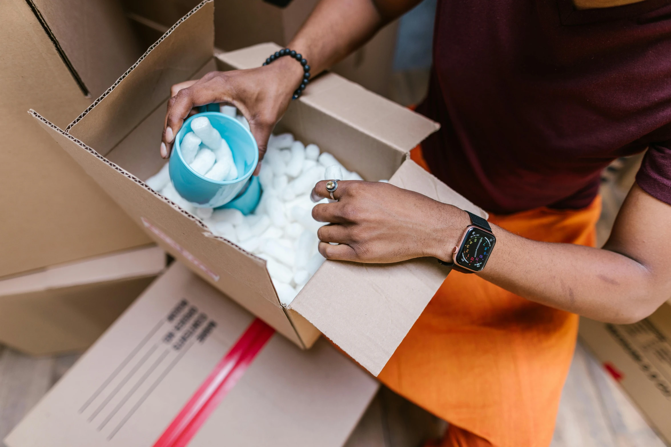 a man is pouring water into a box