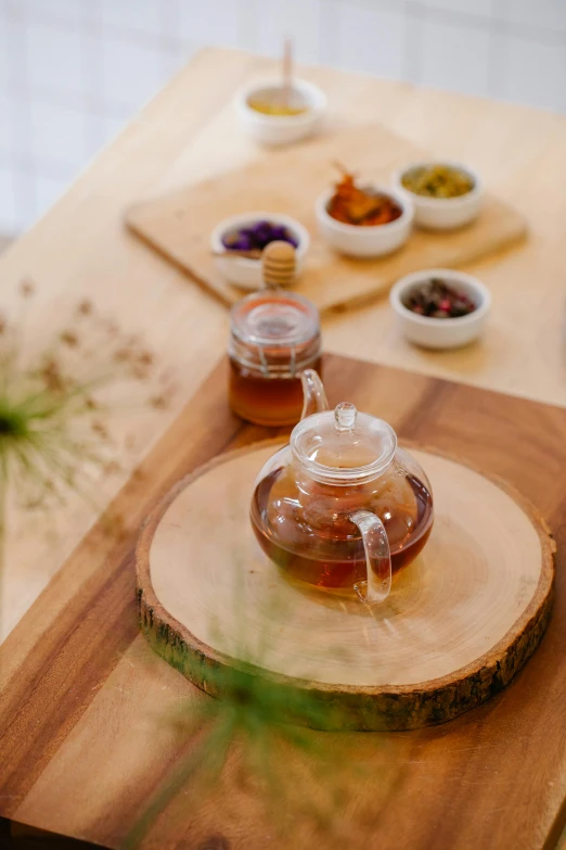 a teapot is sitting on a wooden surface