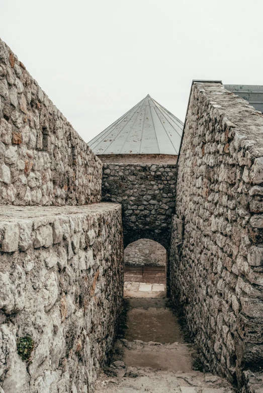 stone walls and arches in an alley