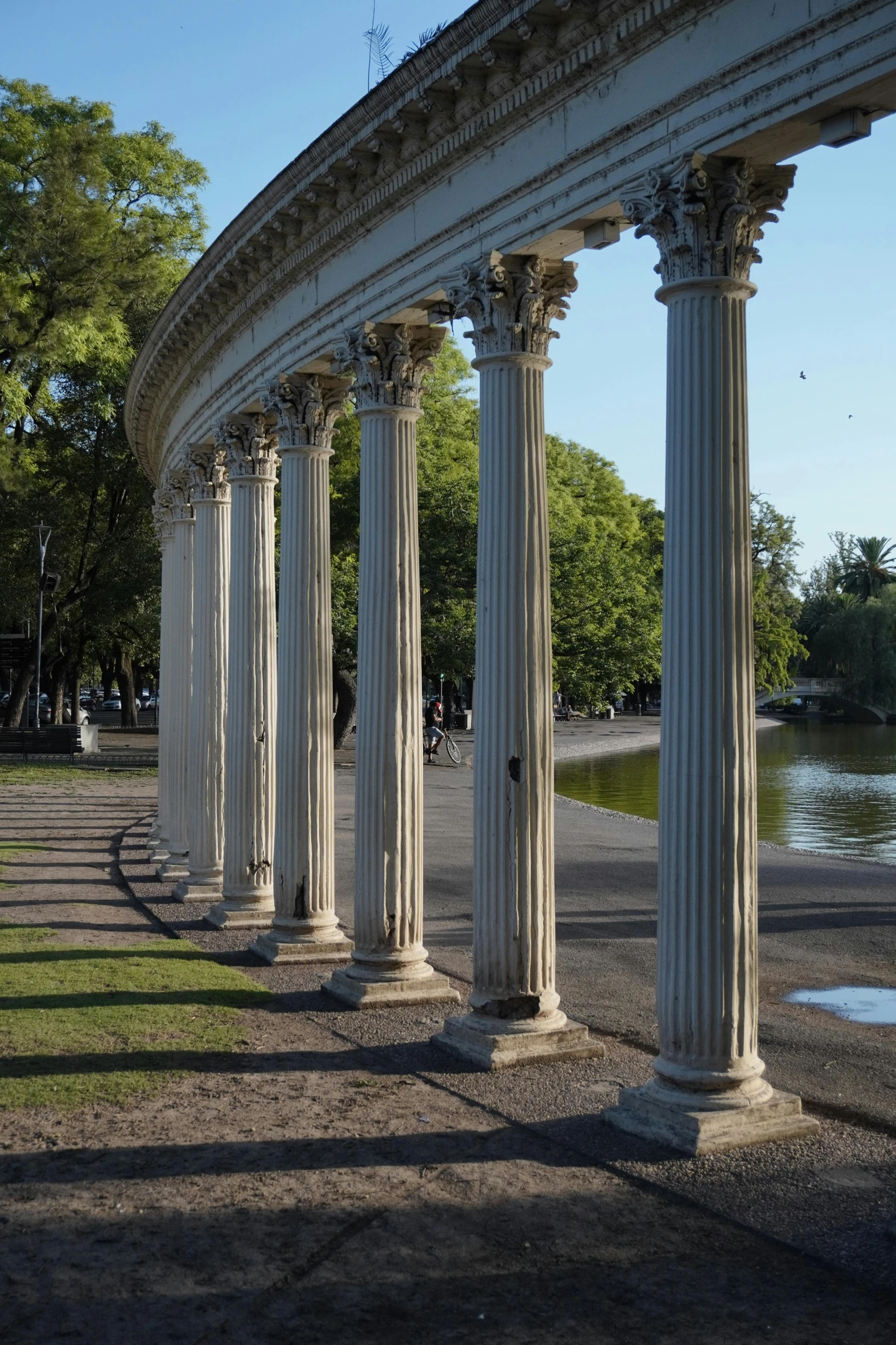 row of marble pillars in a park