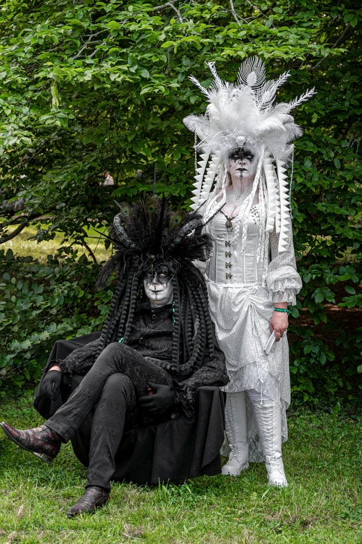 a man in costume posing next to another man