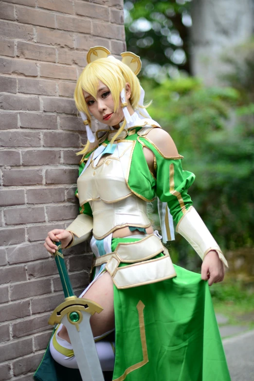a woman wearing a white and green cosplay