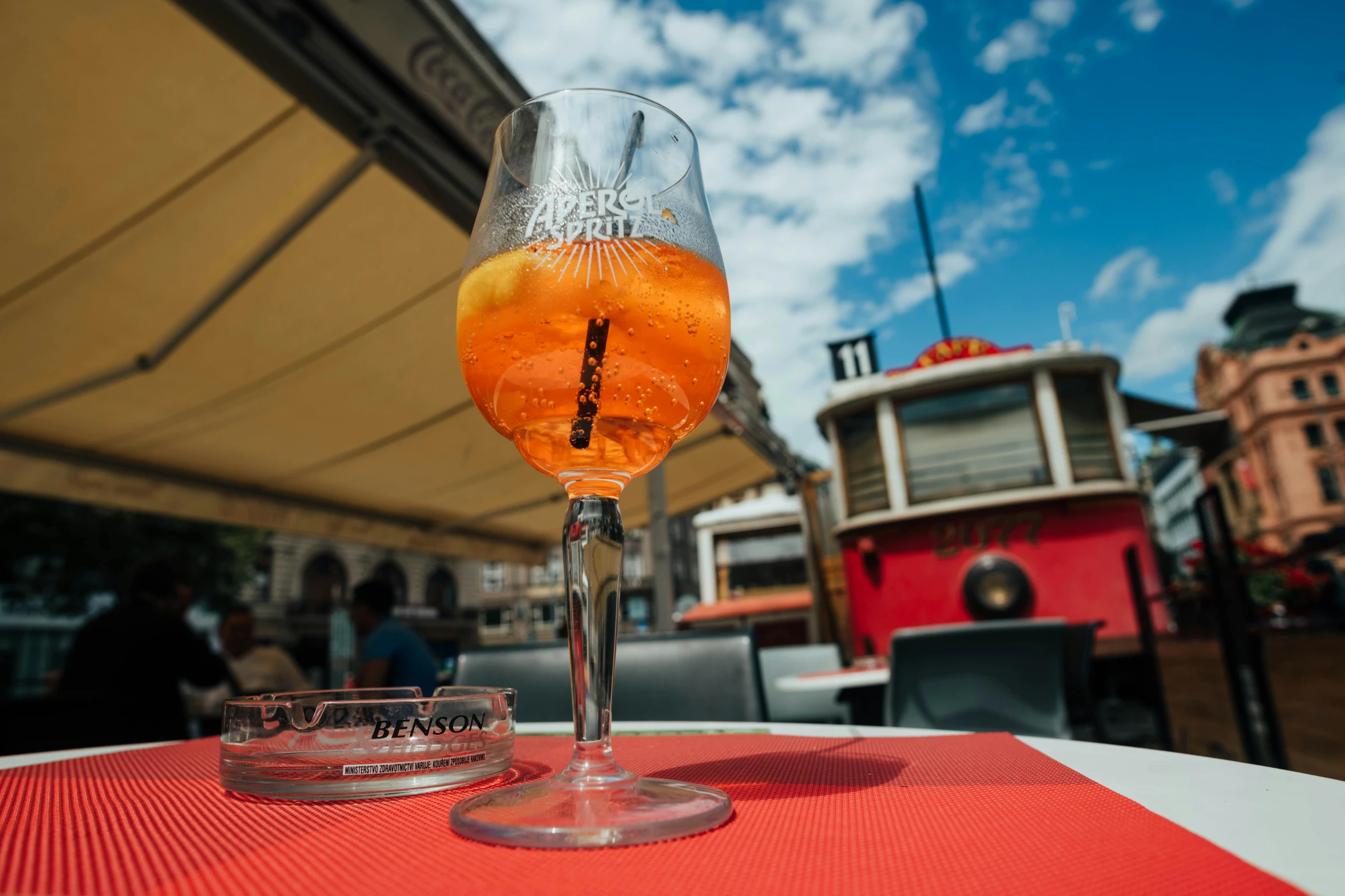 two glasses sit on top of an orange and white table