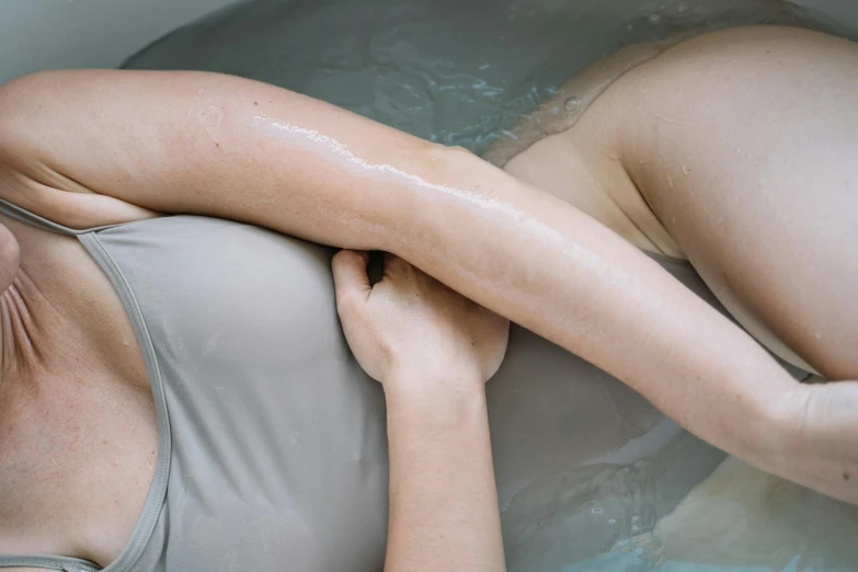 a close up of a person in a tub of water