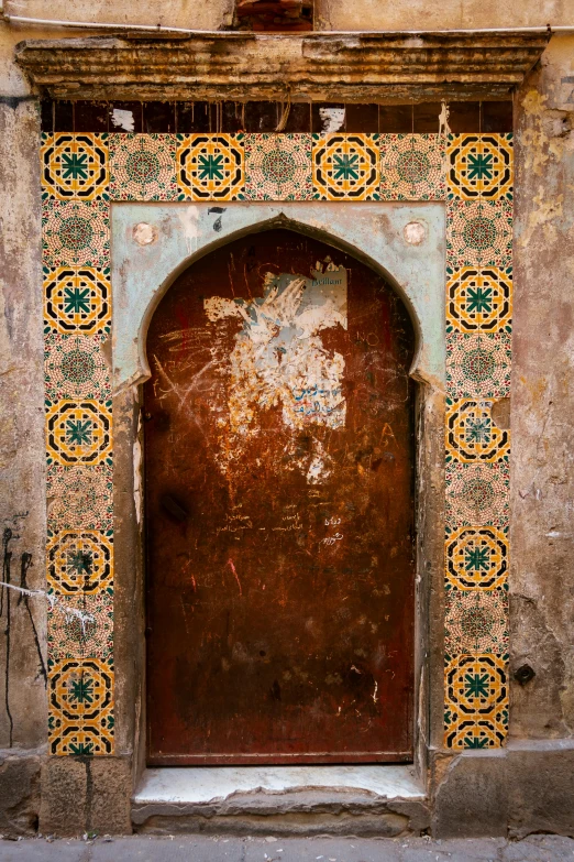 a very ornate brown door and a brown wall