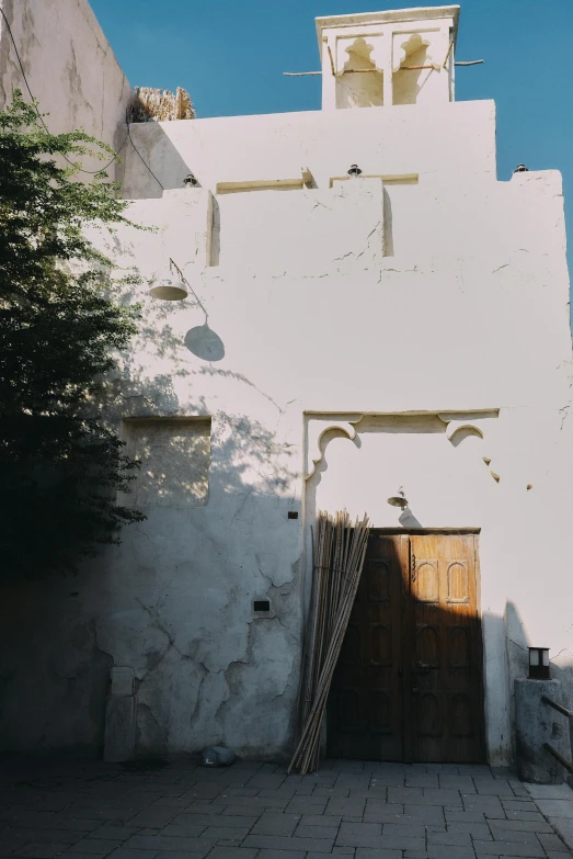 a gate and a door to a building on the street