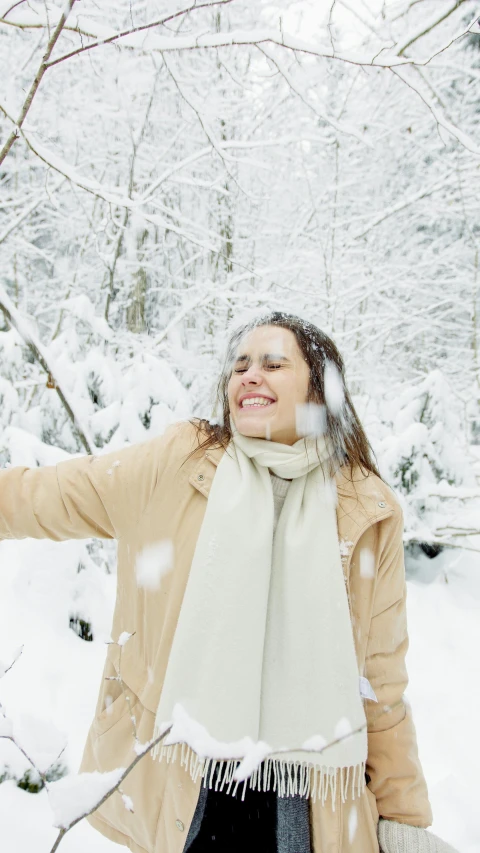 a woman wearing a scarf is in the snow