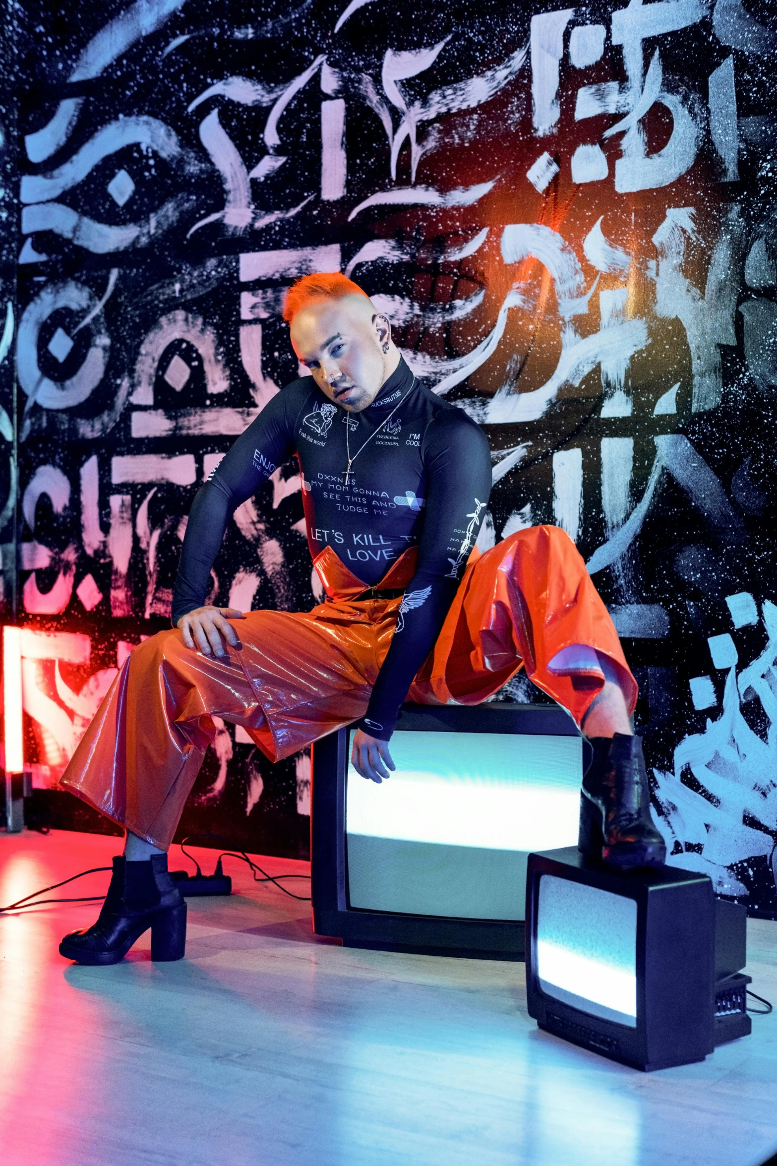 a mannequin sits on a television set with red lighting