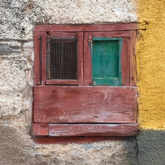 a window on the wall and below, with a grated screen above