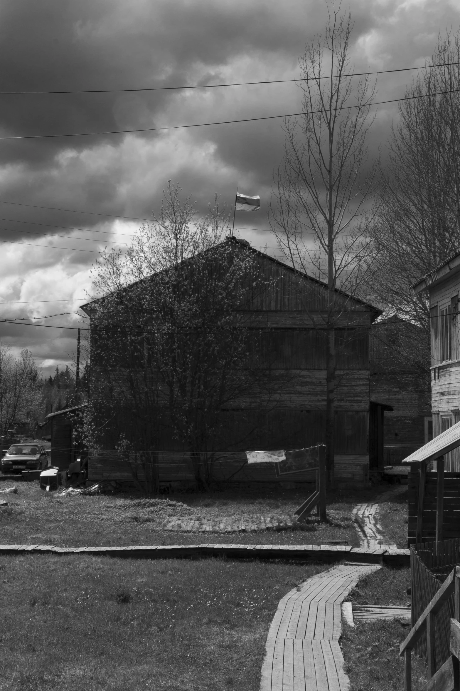 a farm with barn and road going to other side