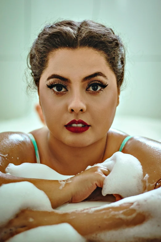 a woman getting her face bathed in soap