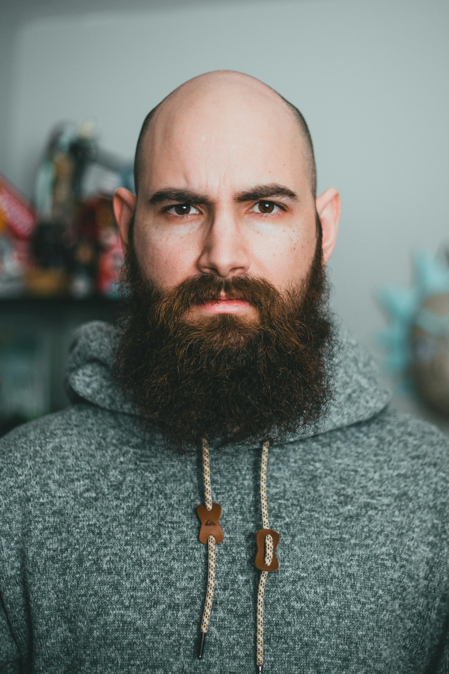 a man with a very large beard standing in a room