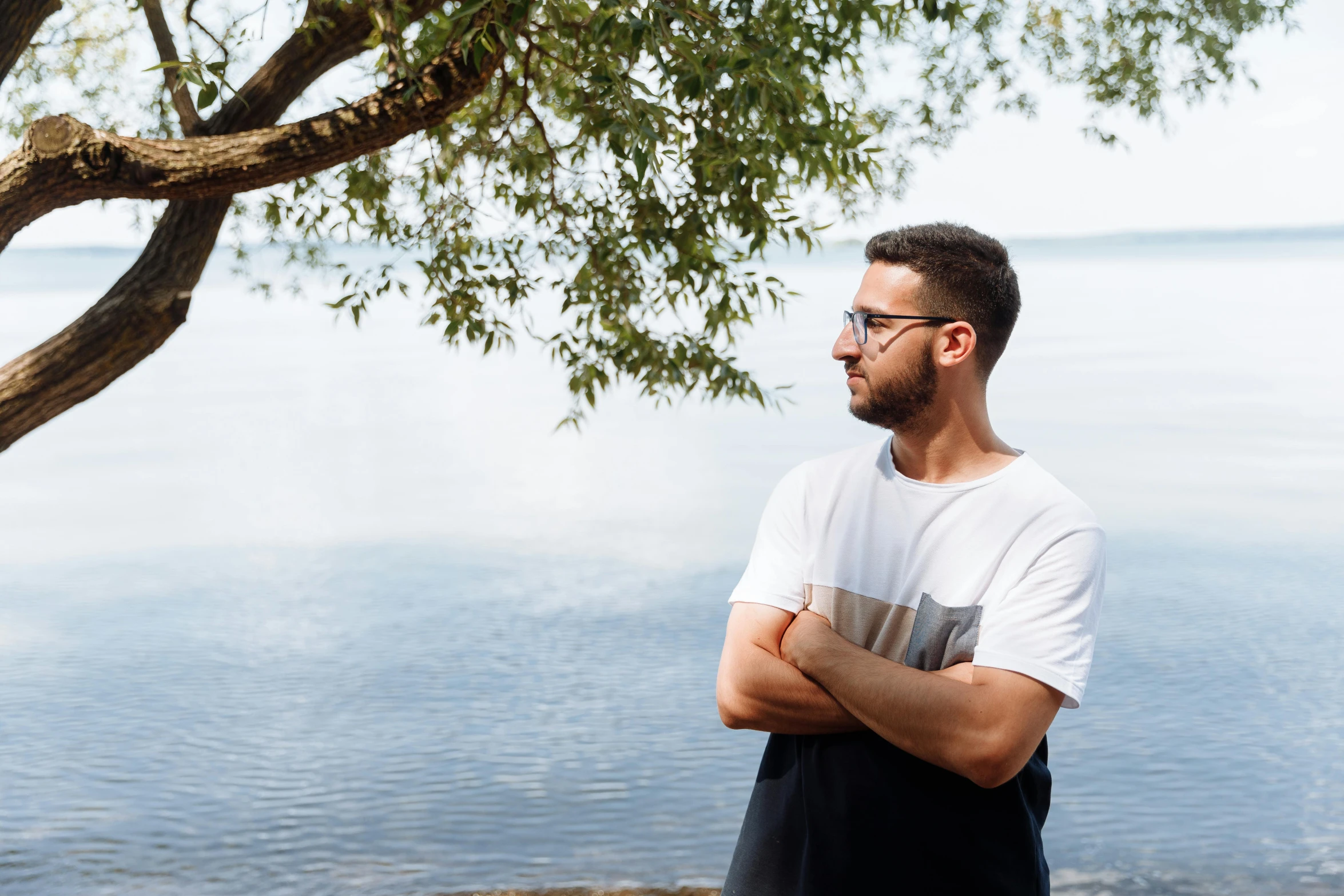 a man that is standing near some water