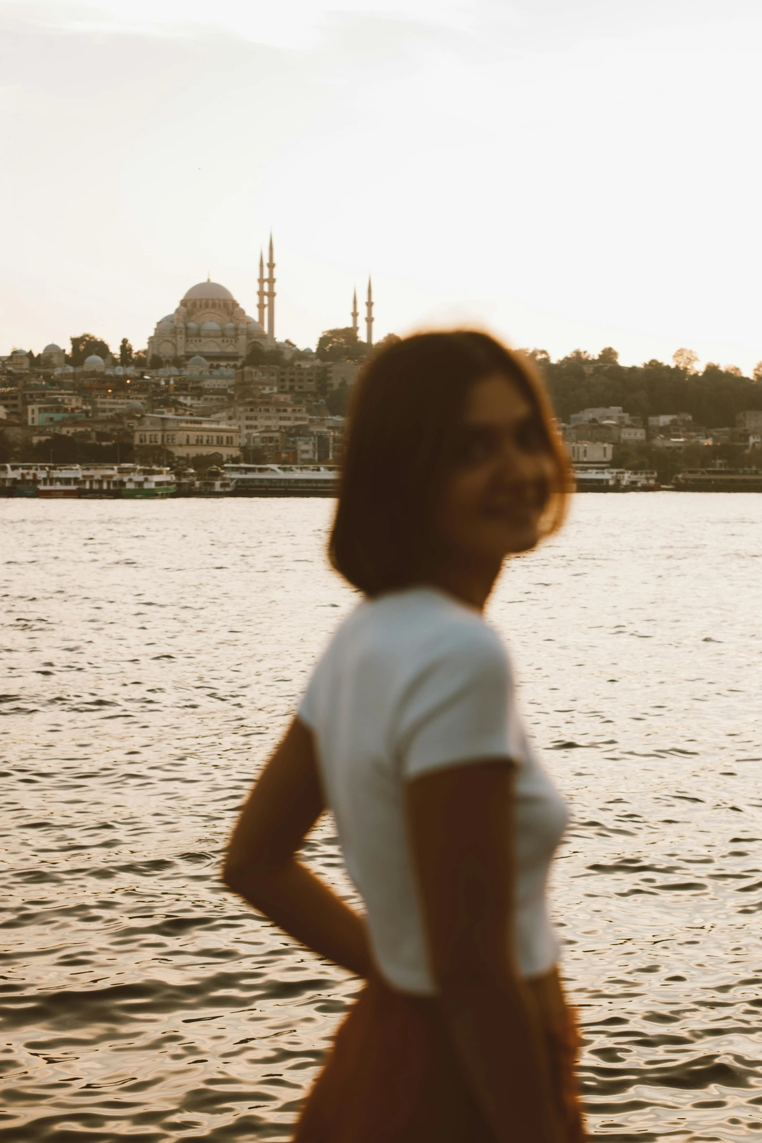 an image of woman standing in water posing for camera