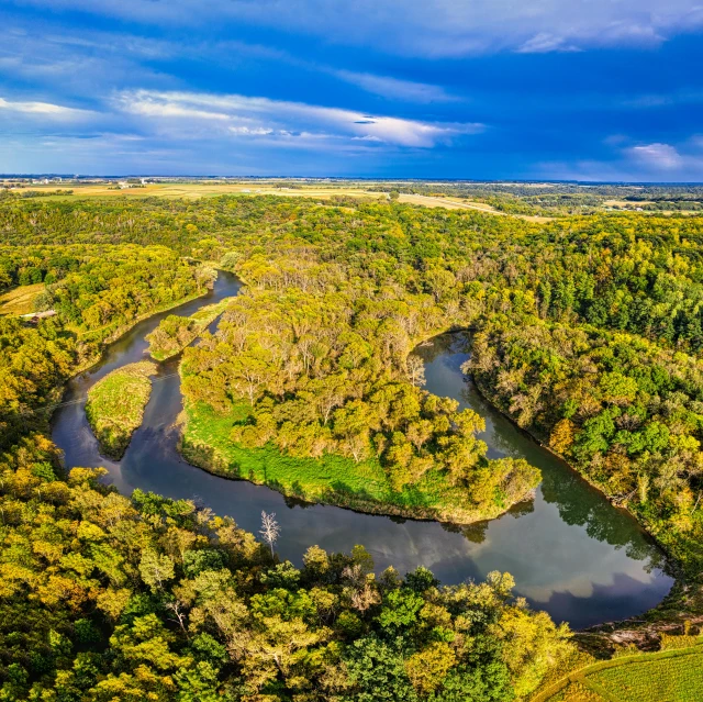 a view of a small river in a field