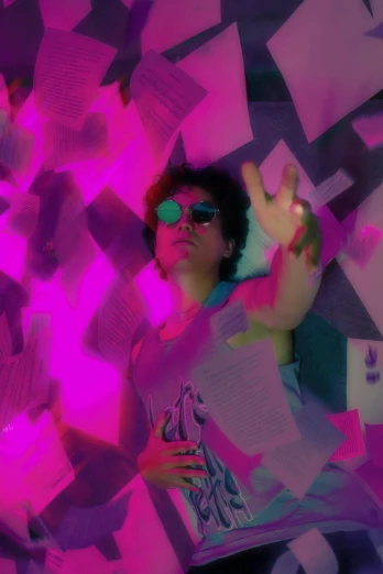 a woman is holding up a large pink wall