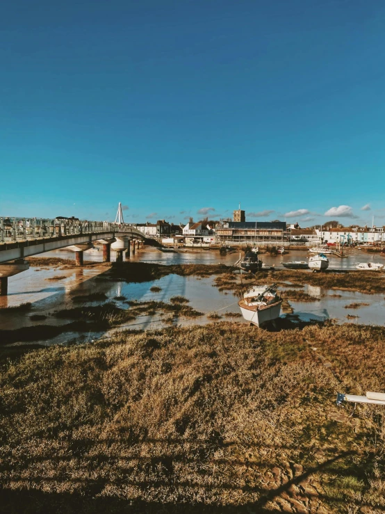 a river that has lots of boats floating on it