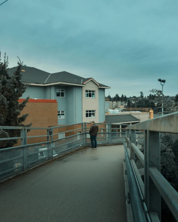 a person on a walkway with an umbrella