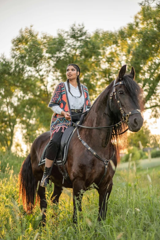 a woman is riding a horse in the grass