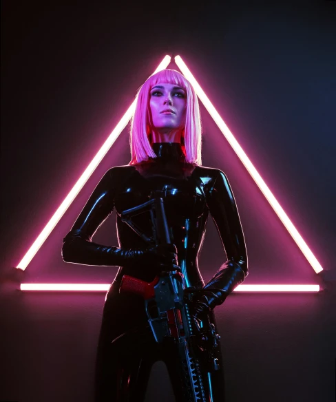 a woman standing in front of a neon triangle