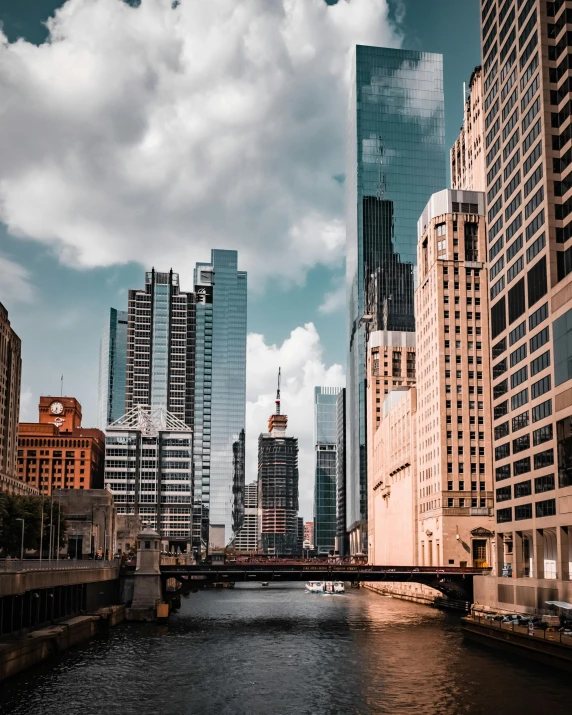 some very tall buildings and a bridge over a river