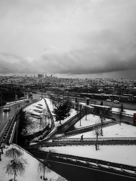 a city skyline in winter time with snow all over