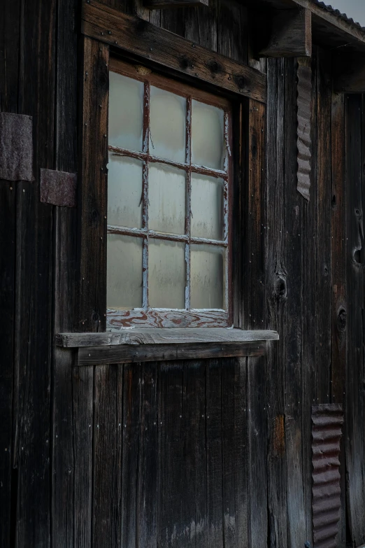 a window sits on the side of a building