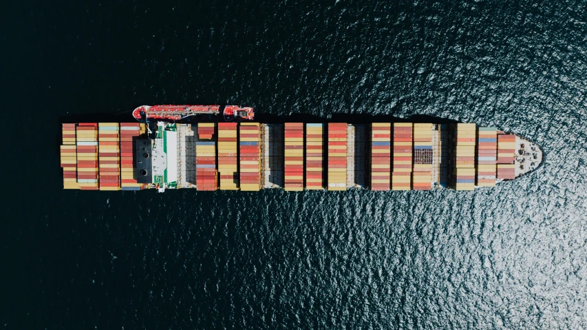 an aerial s of the side of a cargo container ship