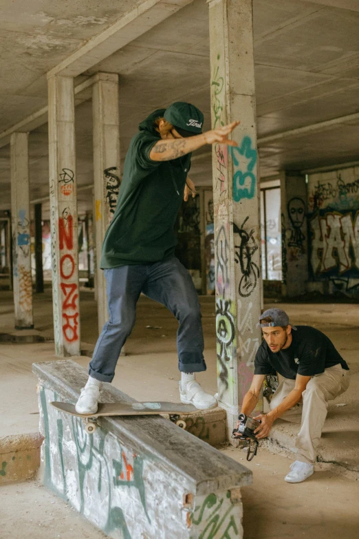 a boy on a skateboard and another man on a skateboard