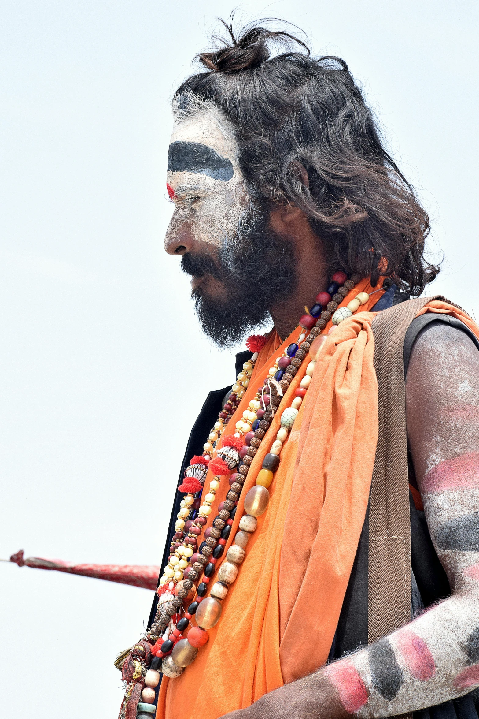 a person that is dressed up with paint on his face