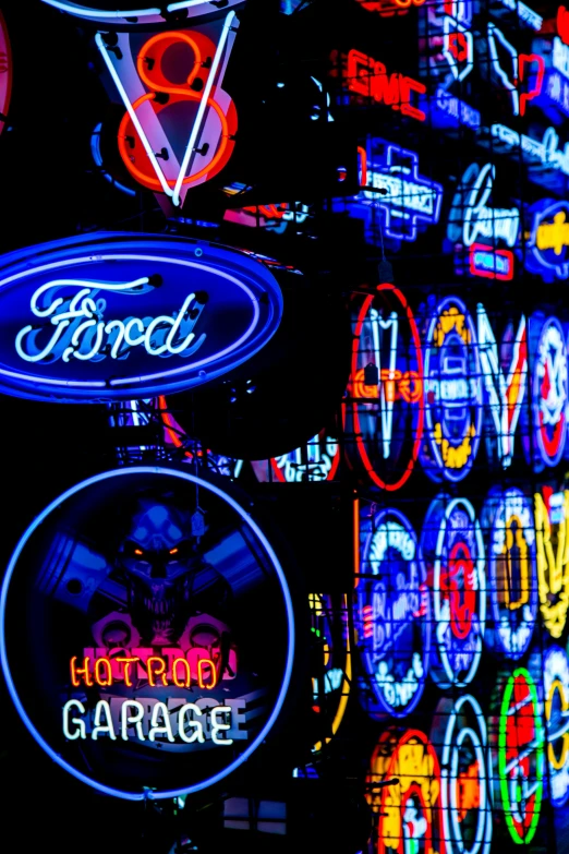 closeup view of various neon signs at a garage