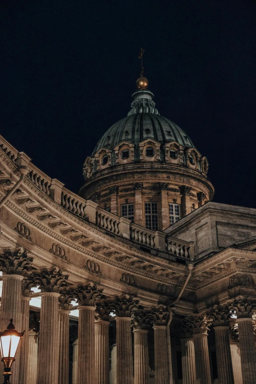 a building with columns and a large dome