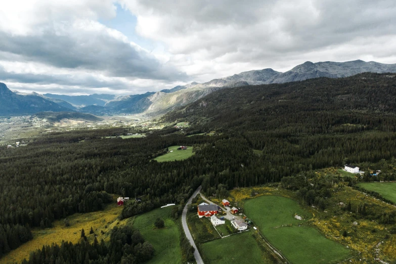 aerial view of mountains, roads and farm buildings