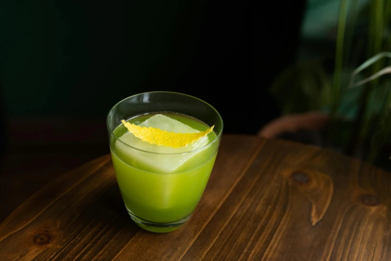 a lime drink with an ice cream stick sticking out of it