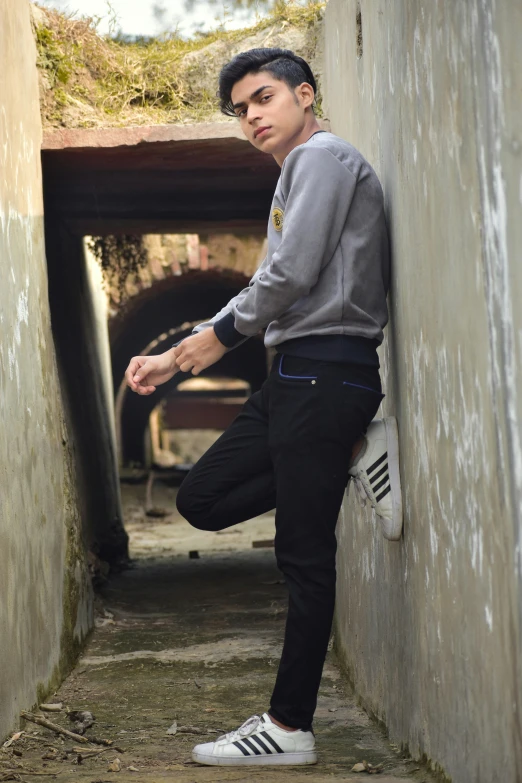 the young man is posing on his skateboard