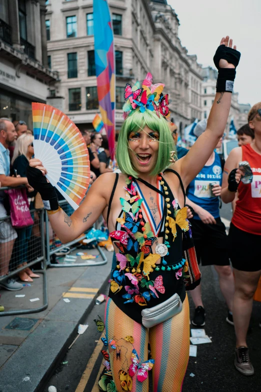 a woman dressed in a colorful body suit