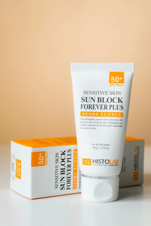 the sun block for very dry skin with sunscreen is sitting next to a cardboard box