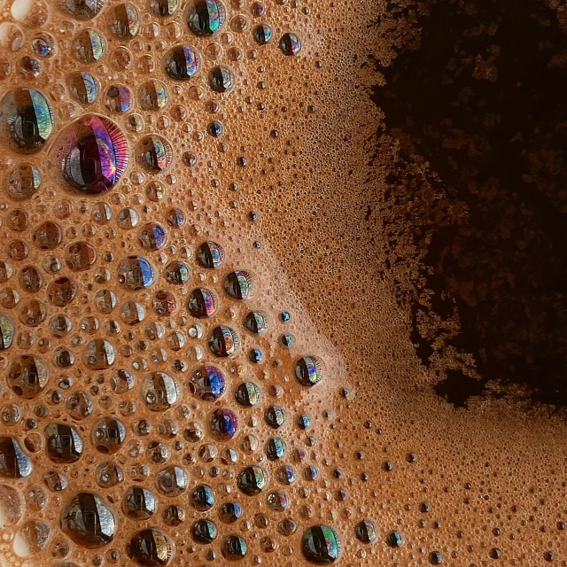 a close up view of bubbles in a foamy surface