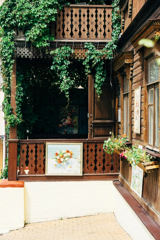 a porch covered with green plants and ivys