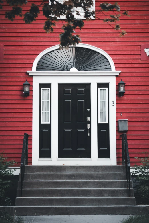 a red building with a black front door