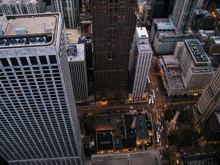 an aerial view of tall buildings at night